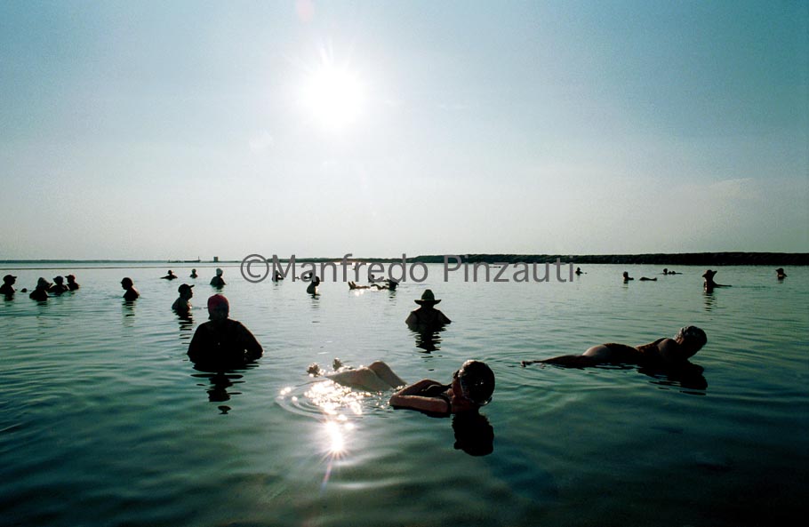 Death Sea . Death Sea . Turists in the hot and salt water of the Sea .